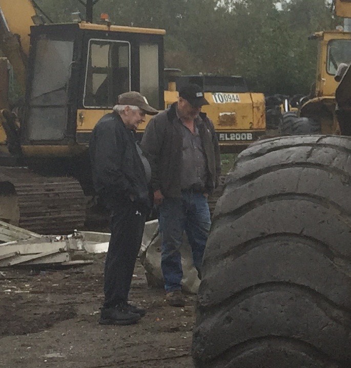 Ralph Wise of Premium Equipment Sales Ltd. with a heavy equipment trader